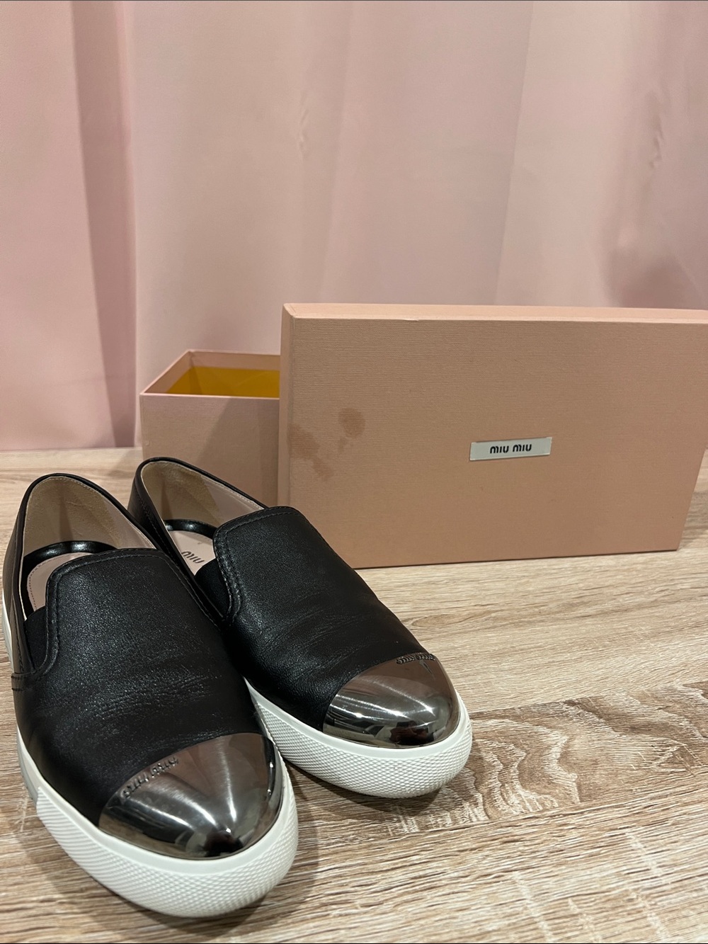 Miu Miu Black Leather Slip-On Sneakers with Silver Cap-Toe